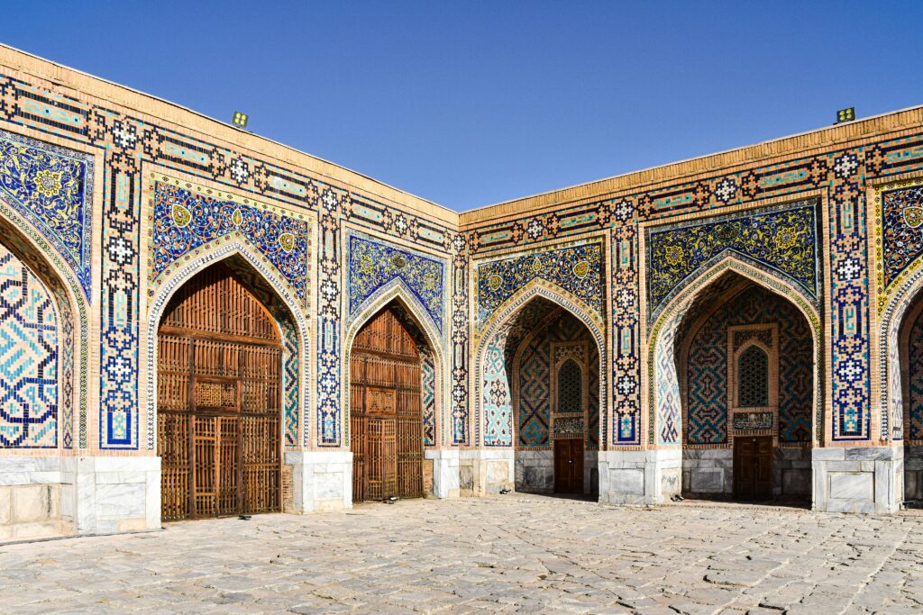 Beautiful courtyard view of Tilya-Kori Madrasa in Samarkand, showcasing stunning Islamic architecture.